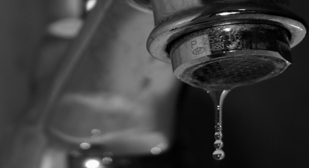water faucet drip closeup